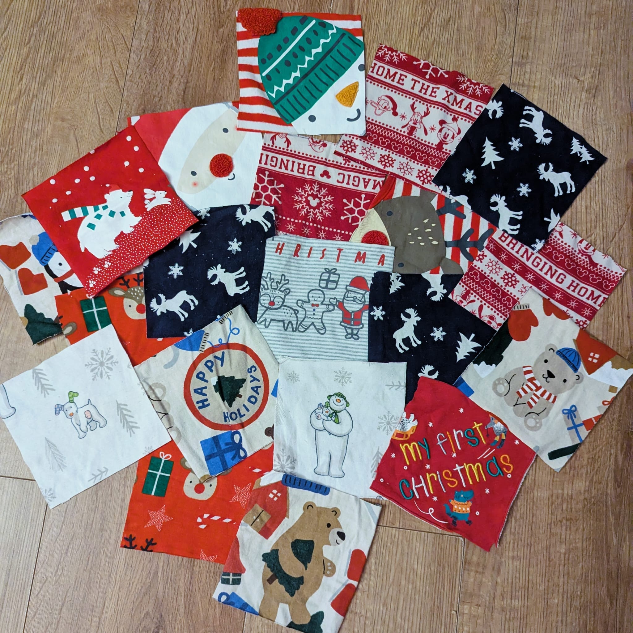 Spread of Christmas fabric squares ready for crafting